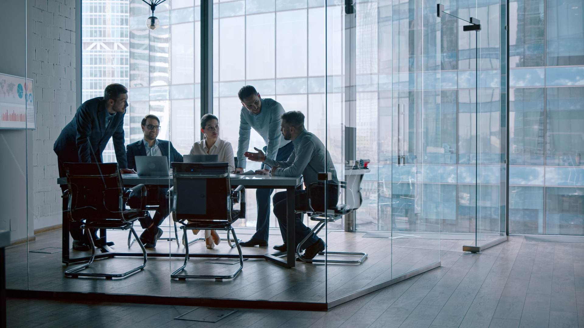 Deal team working together in a boardroom